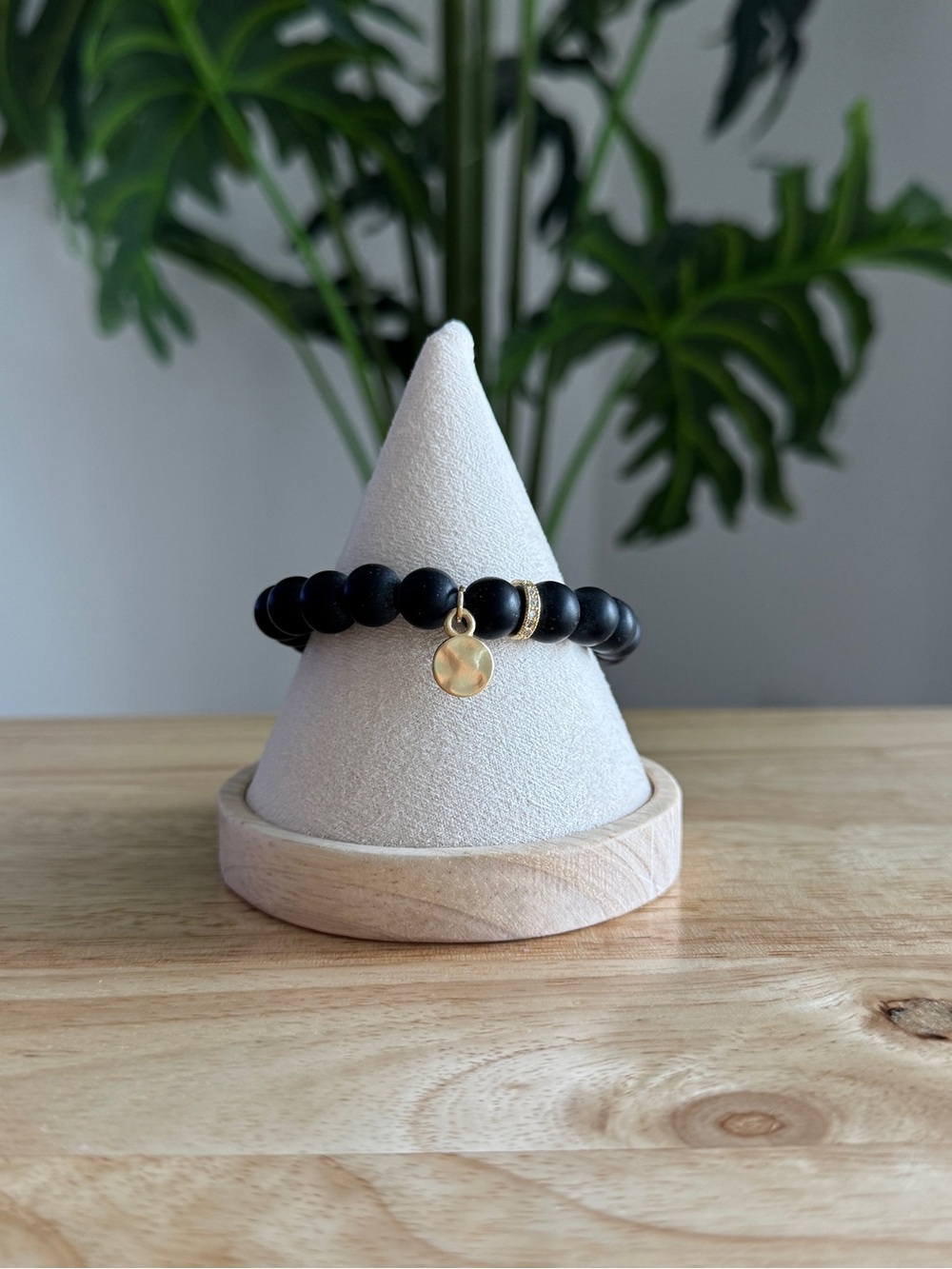 Matte Black Beaded Stretch Bracelet with Gold Charm